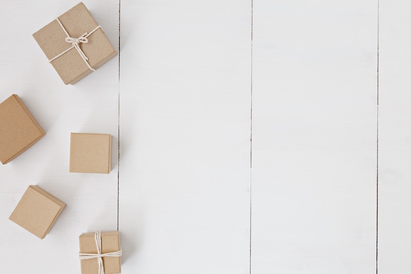 Photo of a brown gift box on white surface